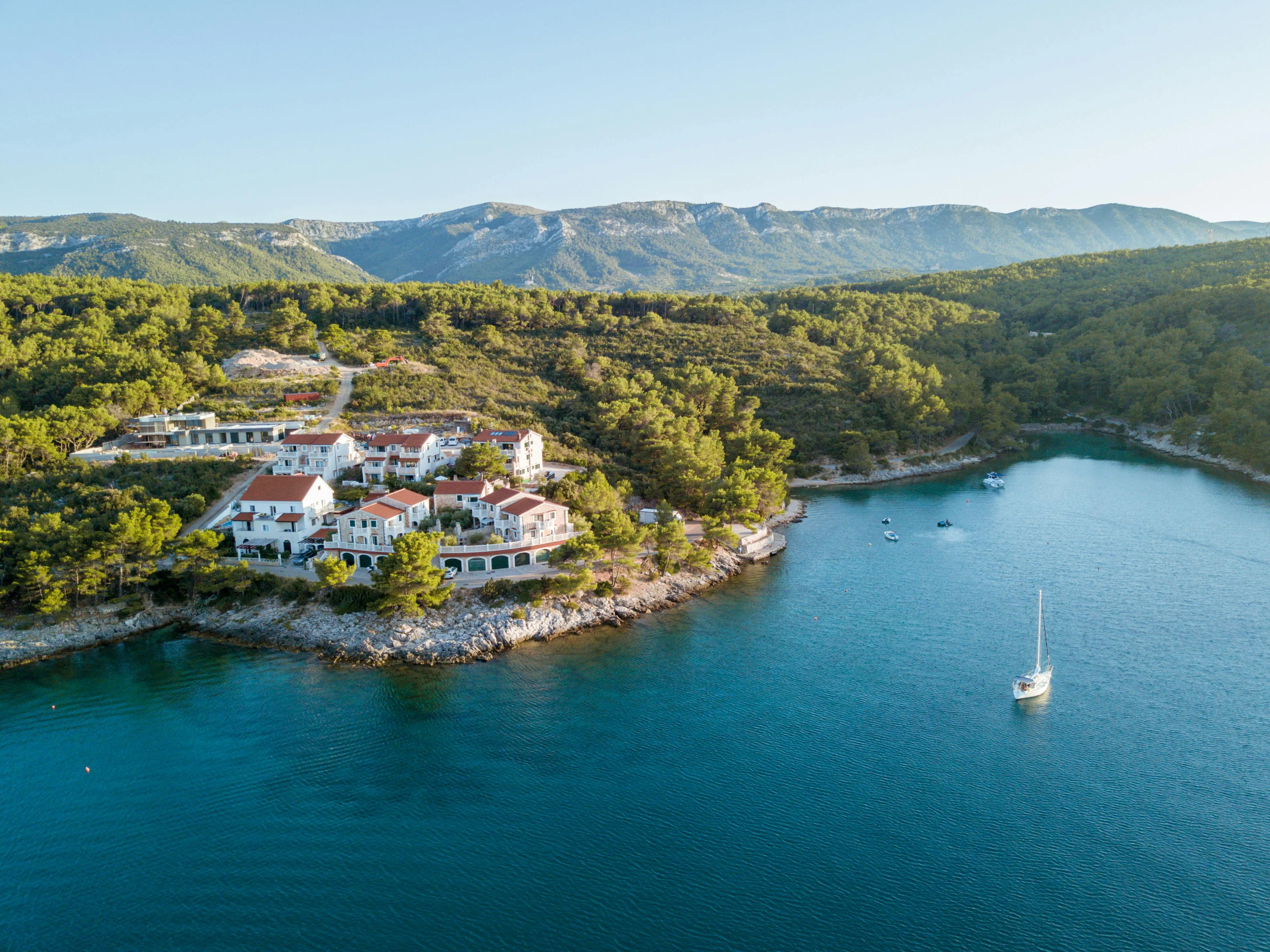 Breathtaking aerial shot of Jelsa's scenic coastline, capturing lush greenery and tranquil waters.