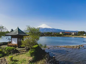Lake Kawaguchi offers a peaceful view of Mount Fuji. The calm water and surrounding scenery create a quiet and relaxing atmosphere.