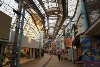 Vibrant view of Heiwa Dori Shopping Street, Naha, with bustling market atmosphere.