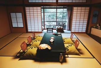 A ryokan is a traditional Japanese inn that offers an authentic and peaceful experience. Guests sleep on tatami mats and futons, often enjoying hot baths and traditional meals.