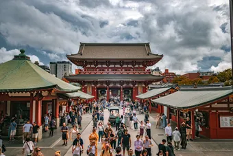 Sensō-ji is a landmark temple located in Tokyo’s Asakusa district. The scene often shows lively crowds walking toward the main gate and hall.