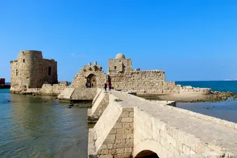 The Sidon Sea Castle stands on a small rocky island off the Mediterranean coast, connected to the city by a stone causeway. Built by the Crusaders in the 13th century, it once defended the ancient harbor of Sidon.