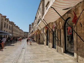 The Stradun, the main thoroughfare of Dubrovnik’s Old Town, links the Pile and Ploče gates along a beautifully polished stone street. Lined with palaces and Baroque buildings, this iconic avenue is the historic, cultural, and social heart of the city.